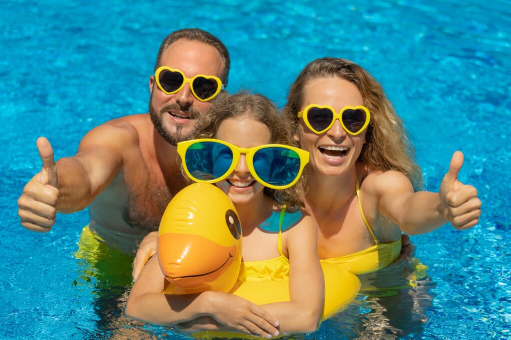 Happy family in outdoor pool