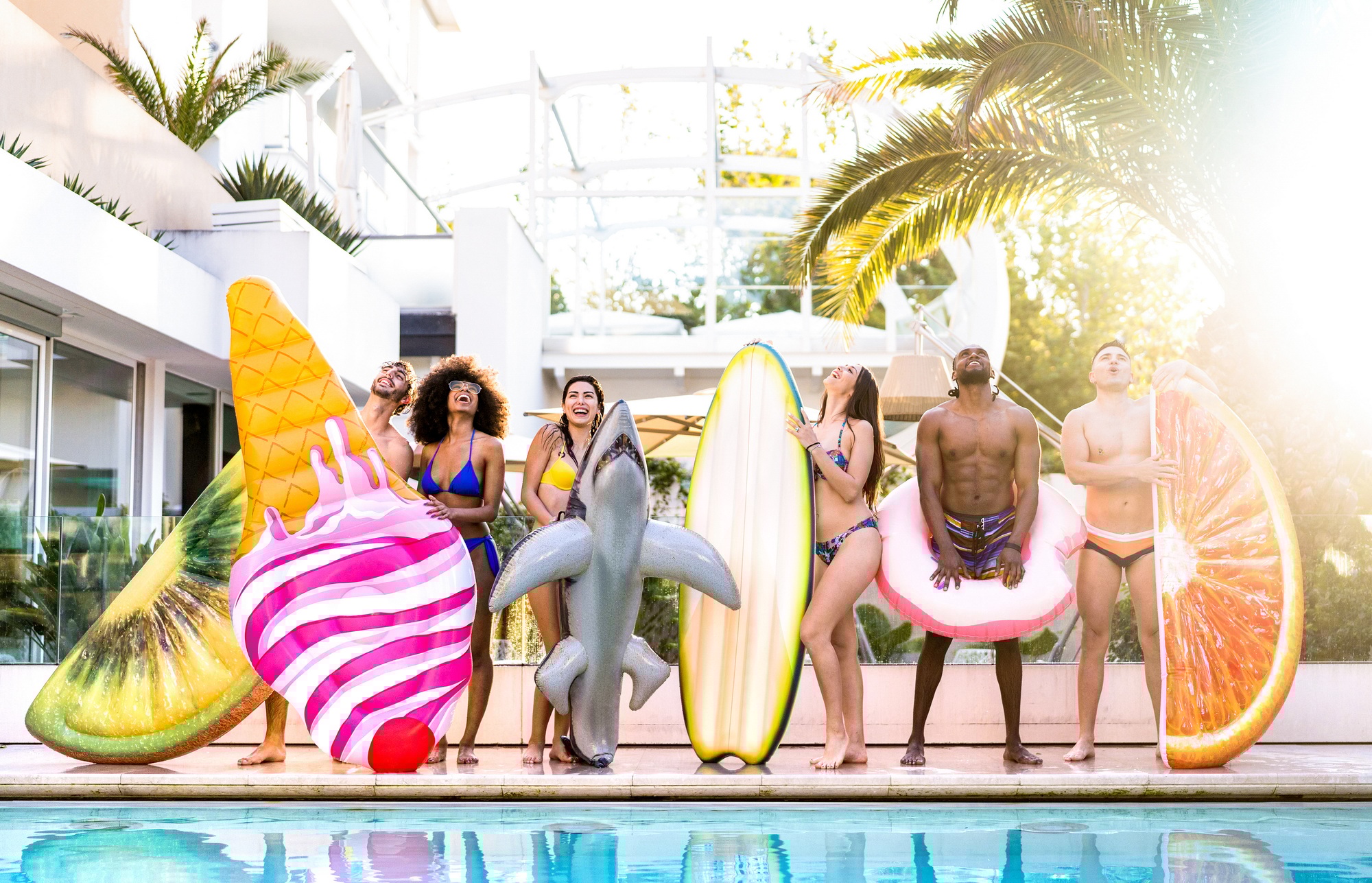 Young friends at swimming pool party